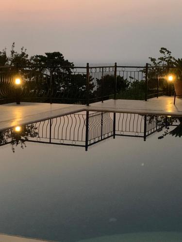 a view of a pool of water at night at Spectacular views from this villa in Lapta in Kérynia
