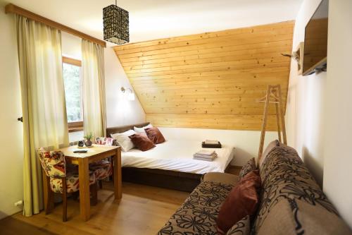 Postel nebo postele na pokoji v ubytování Apartments Sport House Novakovic