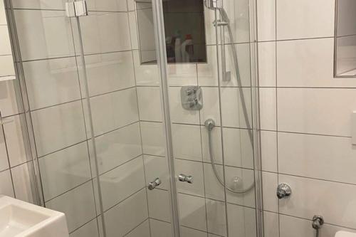 a shower with a glass door in a bathroom at 76 m² Ferienwohnung 2 Schlafzimmer, max. 7 Gäste in Kennelbach