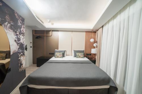 a bedroom with a large bed in a room at Fama Karaköy in Istanbul