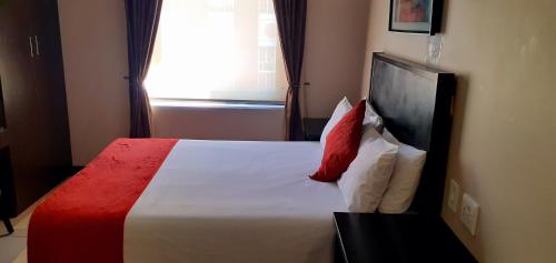 Ένα ή περισσότερα κρεβάτια σε δωμάτιο στο Comfy & Spacious Apartments