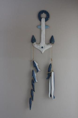 a group of fish hanging on a wall at Sarah's Place Guesthouse in Pretoria