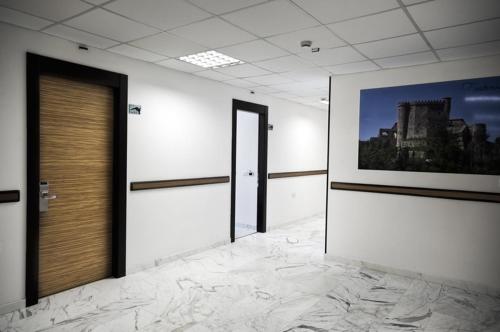 a room with a picture of a building on the wall at Hotel Rondine in Marinella di Sarzana
