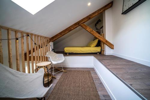 a room with a bed in the attic at Le Boheme - Rent4night Grenoble in Grenoble