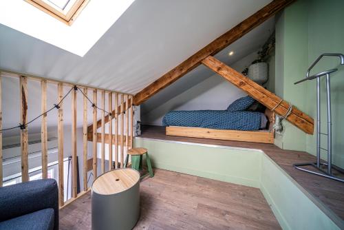 a loft conversion with a bed in the attic at le Chartreuse / Rent4night Grenoble in Grenoble