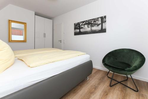 Postel nebo postele na pokoji v ubytování Ferienhaus Kuestenwind