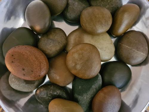a pile of rocks in a bowl on a table at Amberhall Guesthouse in Johannesburg