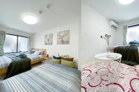 a bedroom with two beds and a living room at japan house shinkoiwa in Tokyo