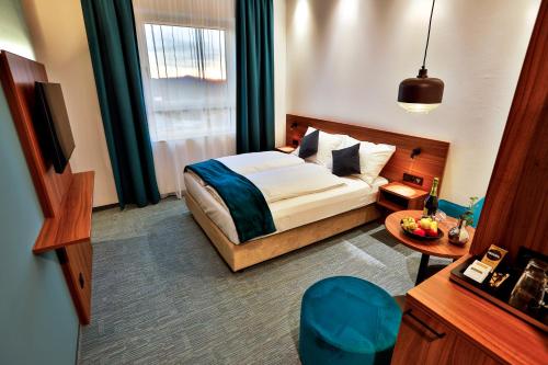 Postel nebo postele na pokoji v ubytování Hotel Das Zeit