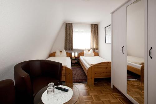 เตียงในห้องที่ Mittelrhein Pension