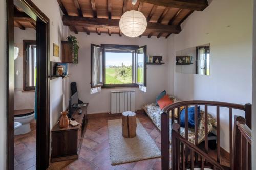 a living room with a couch and a window at La Casa di Smilla - (Bevagna) in Foligno