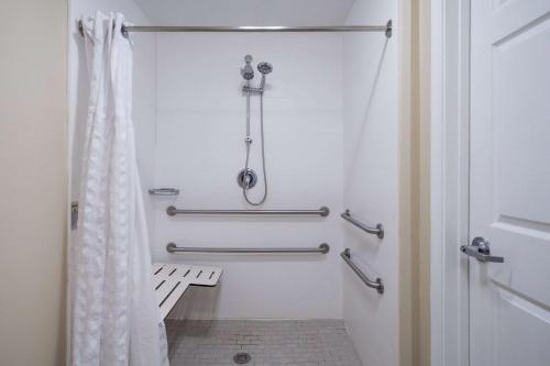 a bathroom with a shower with a shower curtain at Quality Inn Wilmington in Wilmington