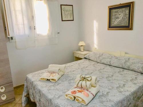 Ένα ή περισσότερα κρεβάτια σε δωμάτιο στο Tenuta Rosa Casa Salento Holidays