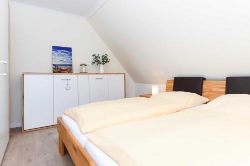 Postel nebo postele na pokoji v ubytování Haus Meerzeit