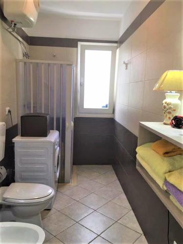 Ένα μπάνιο στο Tenuta Rosa Casa Salento Holidays