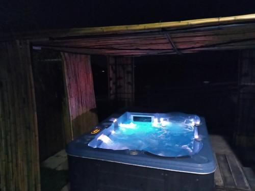 a hot tub in the middle of a room at Kalamospito Holiday House in Kalokhorio