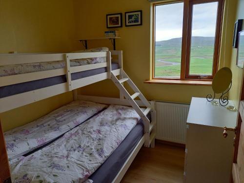 Postel nebo postele na pokoji v ubytování Kópareykir Cottage