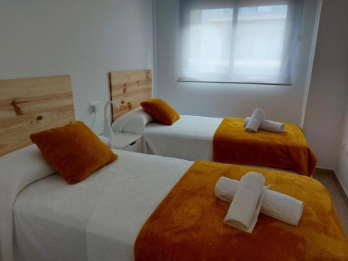 Кровать или кровати в номере APARTAMENTO MARINA BEACH