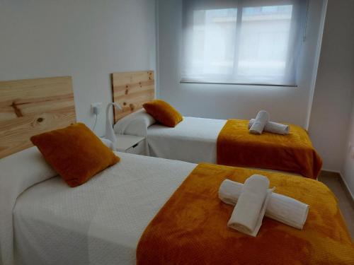 Katil atau katil-katil dalam bilik di APARTAMENTO MARINA BEACH