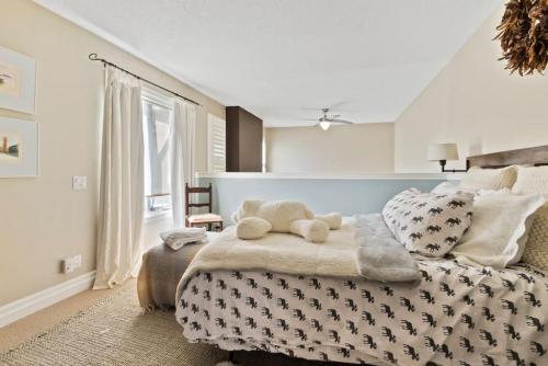 a bedroom with a large bed with pillows on it at Elegant Sierra Lane Retreat 88780 in Blue Mountains
