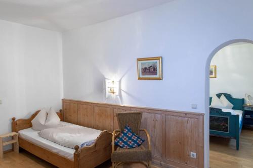 a living room with a couch and a chair at Fischerstüberl Attel in Wasserburg am Inn