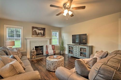 a living room with two couches and a flat screen tv at Idyllic Getaway with Deck about 4 Mi to Dtwn Athens in Athens