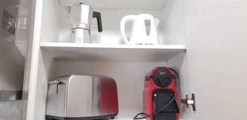 a kitchen with a sink and a toaster and a toaster and a to at Slalom BG Sierra Nevada in Sierra Nevada