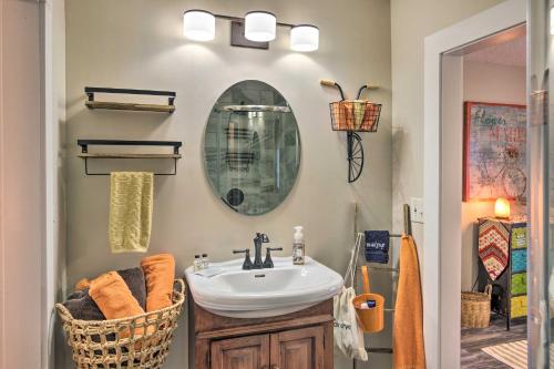 a bathroom with a sink and a mirror at Shaw Creek Cottage with Fire Pit and Forest Views in Hendersonville