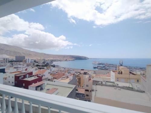 a view of a city from a balcony at Tango House in Arona