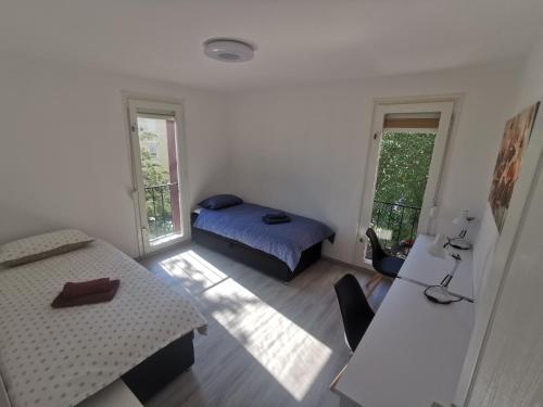 A bed or beds in a room at Apartment Budin 2, Rijeka center
