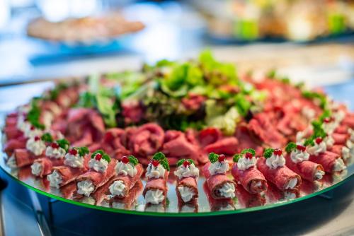 a platter of food on a table at Spa Hotel Diana in Františkovy Lázně
