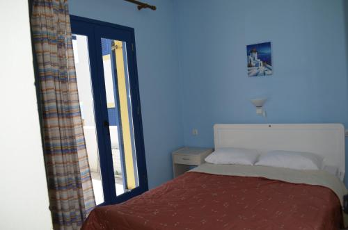 Postel nebo postele na pokoji v ubytování Akti Rooms