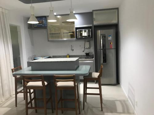Η κουζίνα ή μικρή κουζίνα στο Residencial Ykutiba