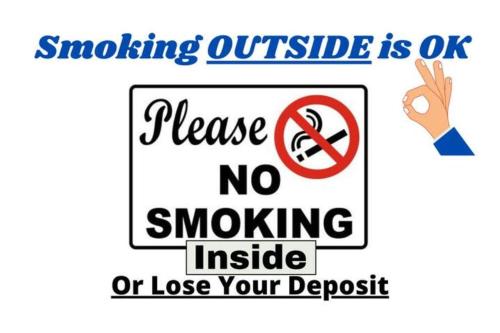 a sign that reads smoking outside is ok because no smoking or lose your deposit at North of Houston! 5 Bedrooms!!Great House!! - Old Mill in Houston