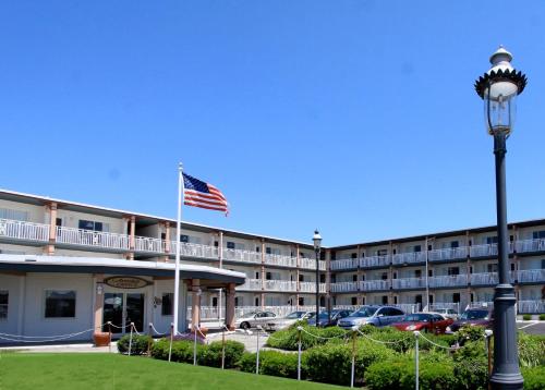 a hotel with an american flag in front of it at Avondale by the Sea in Cape May