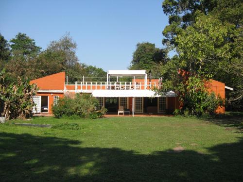 a house with a large yard in front of it at Seven Falls Lodge in Kloof