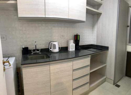 a kitchen with a sink and a counter top at 1353 Amplió y luminoso in Mar del Plata