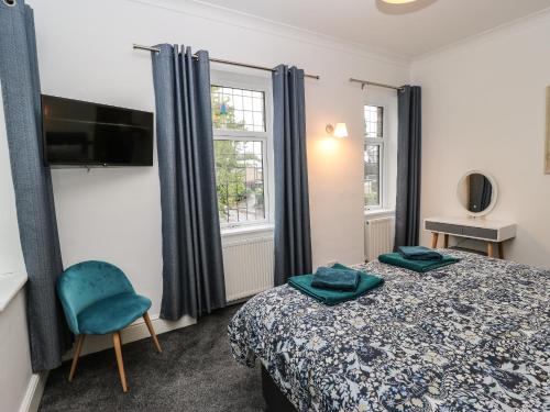 En eller flere senge i et værelse på Gable Cottage