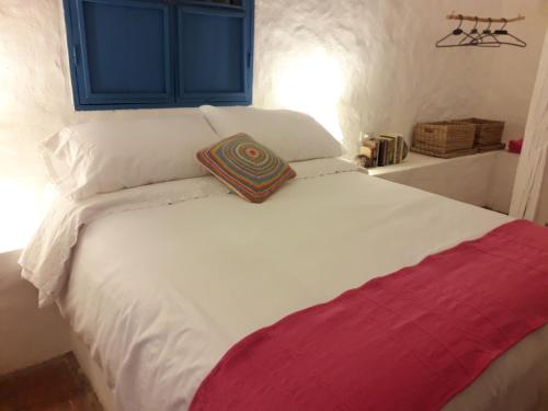 Postel nebo postele na pokoji v ubytování El Oteo Tiny house.