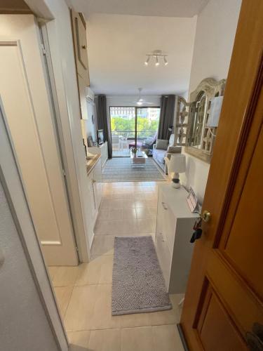 a hallway with a door leading to a living room at Calpe Paraiso Playa primera linea in Calpe