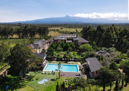 an aerial view of a house with a swimming pool at Misty Mountain Lodge in Naro Moru