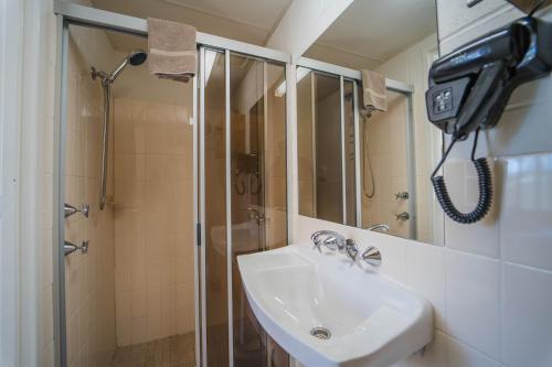 a bathroom with a sink and a shower at Ripparoo Lodge in Falls Creek