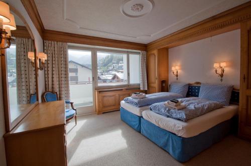 Postel nebo postele na pokoji v ubytování Haus Viktoria A, Apartment Blauherd
