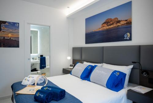 Postel nebo postele na pokoji v ubytování BM SUITES CEFALU