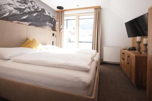 Ein Bett oder Betten in einem Zimmer der Unterkunft Hotel Germania