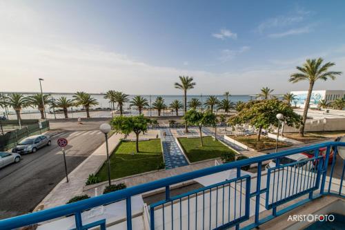 a balcony with a view of a street and the ocean at B&B Una Rotonda sul mare in Manfredonia