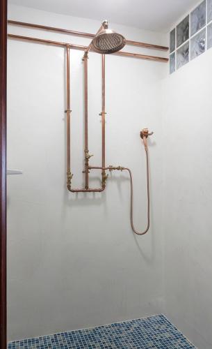 a shower in a bathroom with a glass door at El Hierro Bed & Loft in Valverde