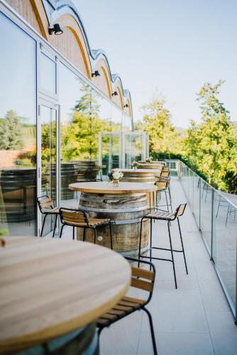a row of tables and chairs on a balcony at Schloss Gamlitz in Gamlitz