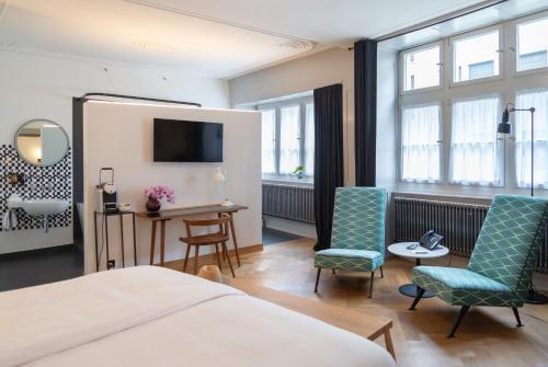 Ένα ή περισσότερα κρεβάτια σε δωμάτιο στο Marktgasse Hotel