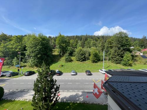 a view of a parking lot with cars parked at Grand Hôtel des Rasses & Wellness in Les Rasses
